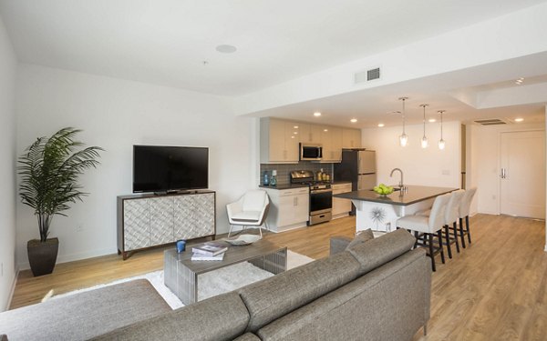 Living room featuring modern decor and ample natural light at ONYX Glendale Apartments