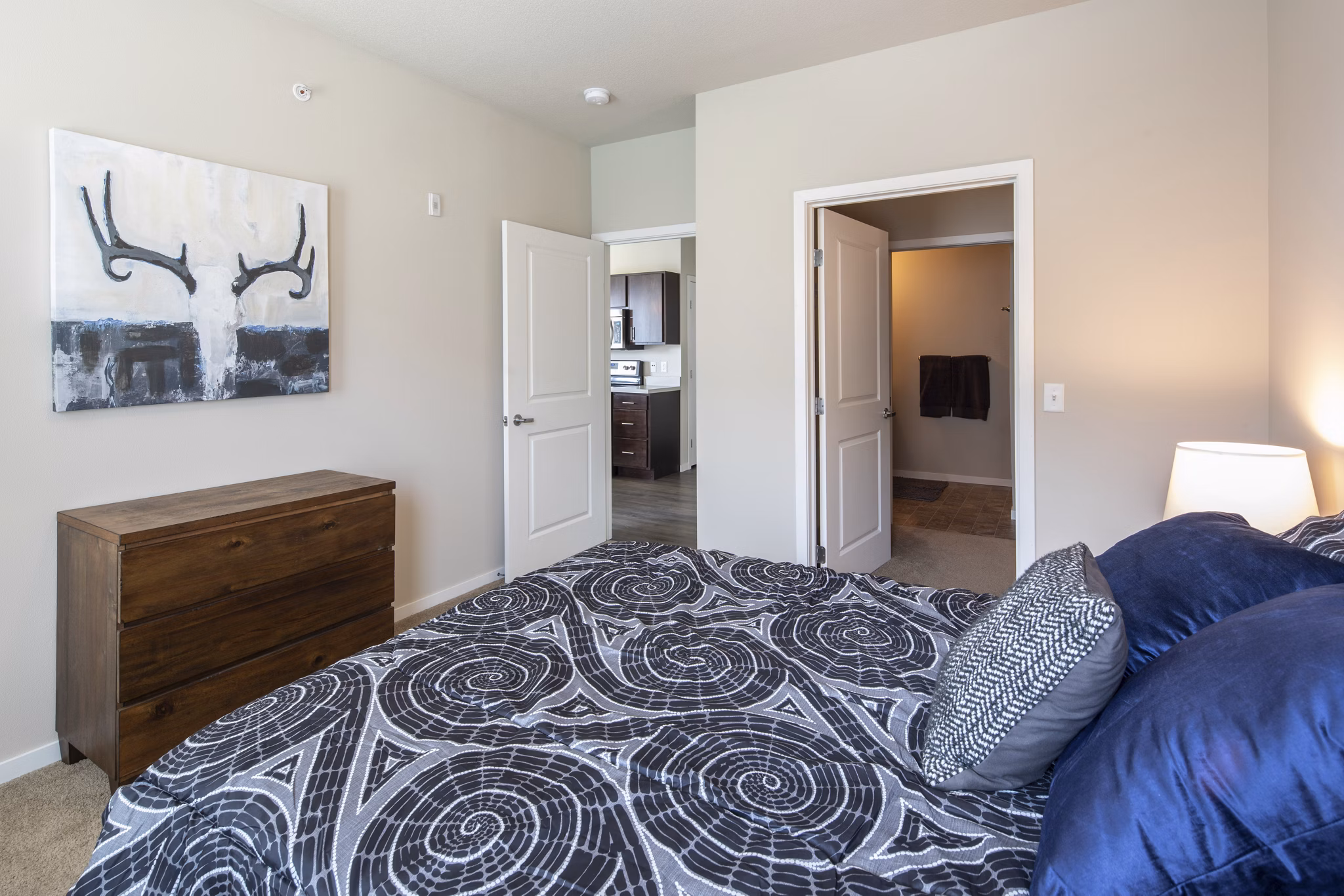 Bedroom with stylish decor and ample natural light in Grain Belt Apartments, a luxury living space offering modern comforts and elegance