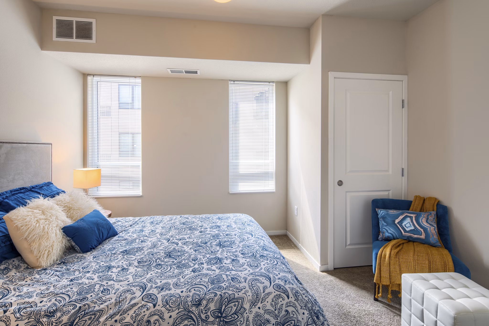 Modern bedroom with cozy decor at Grain Belt Apartments