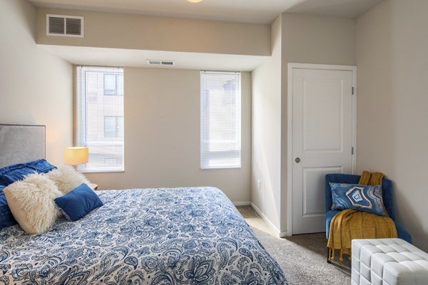 Modern bedroom with cozy decor at Grain Belt Apartments