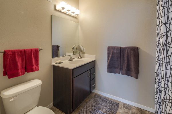 Bathroom featuring modern fixtures at Grain Belt Apartments in luxury complex