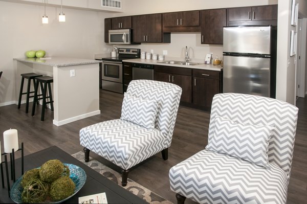 Living room featuring modern decor and natural light at Grain Belt Apartments, luxury spaces designed for comfort and style