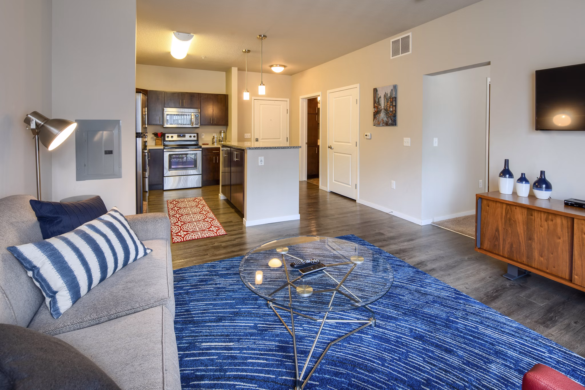 Spacious living room with modern decor in Grain Belt Apartments, offering luxury urban living