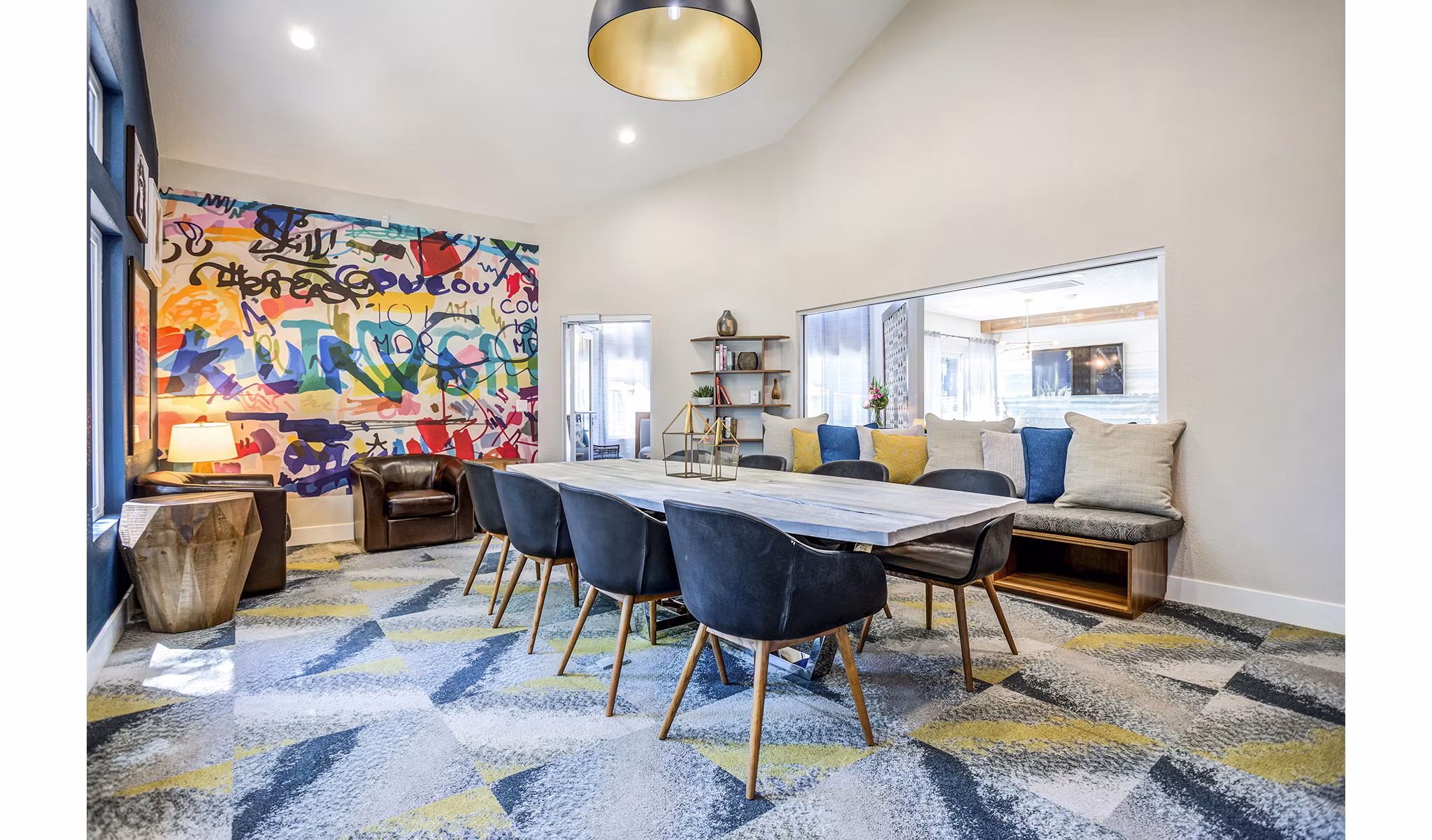 Meeting room featuring modern seating and presentation equipment at Avana Sunnyvale Apartments