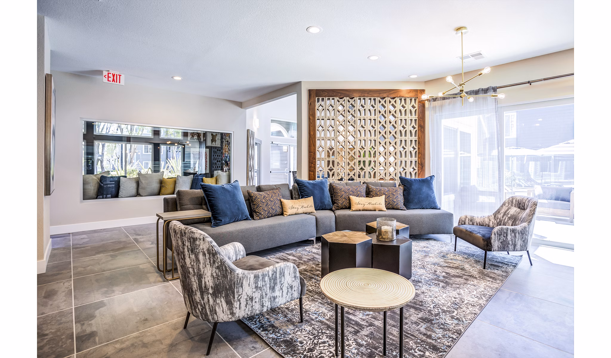 Avana Sunnyvale Apartments: Clubhouse lobby featuring modern design and seating areas for community gatherings