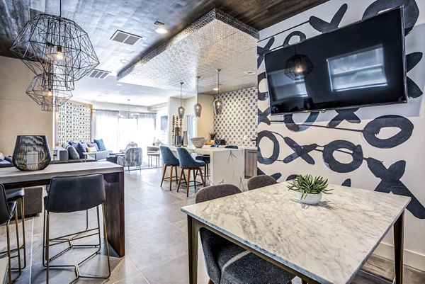Clubhouse lobby with modern decor and seating area at Avana Sunnyvale Apartments, offering luxury living spaces