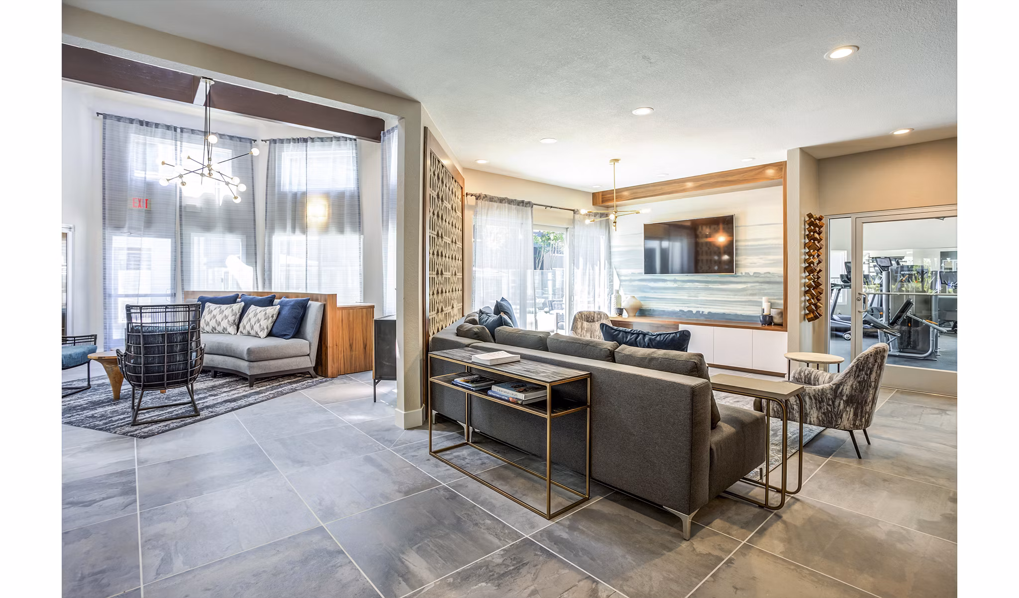 Clubhouse lobby with modern seating and lighting at Avana Sunnyvale Apartments, a luxury Greystar property in Silicon Valley