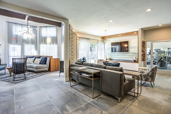 Clubhouse lobby with modern seating and lighting at Avana Sunnyvale Apartments, a luxury Greystar property in Silicon Valley