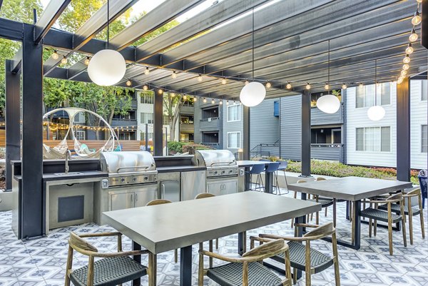 Outdoor grill area at Avana Sunnyvale Apartments offering communal cooking space for residents