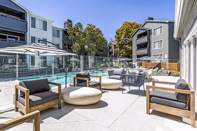Resort-style pool with lounge chairs at Avana Sunnyvale Apartments, luxury living in a vibrant community