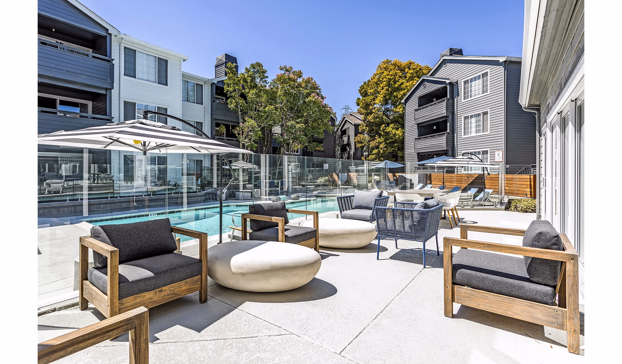 Resort-style pool with lounge chairs at Avana Sunnyvale Apartments, luxury living in a vibrant community