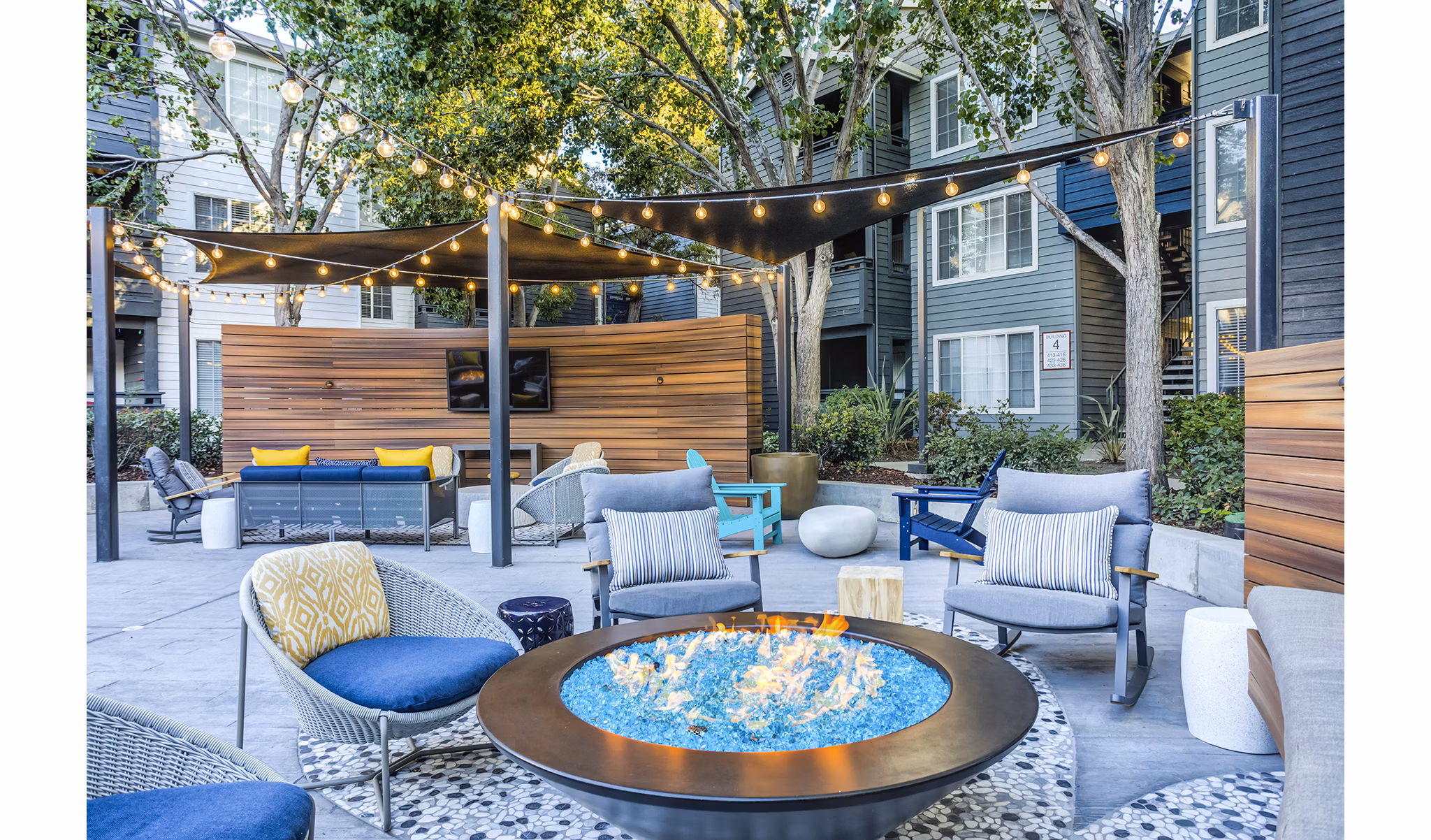 Cozy fire pit seating area at Avana Sunnyvale Apartments patio, perfect for outdoor relaxation
