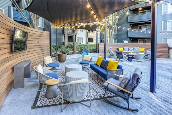 Private balcony with outdoor seating at Avana Sunnyvale Apartments, offering relaxation in a luxurious setting