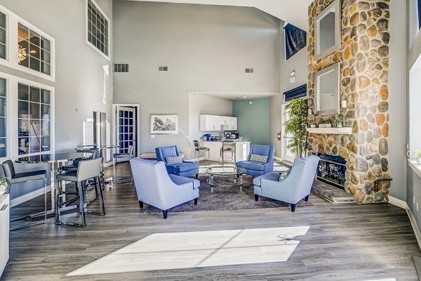 Clubhouse lobby with modern decor and seating at Commons at Briargate Apartments