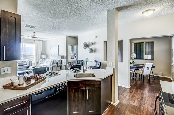 Modern kitchen with sleek countertops and stainless steel appliances at Commons at Briargate Apartments
