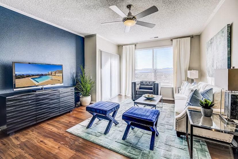 Spacious living room with modern decor at Commons at Briargate Apartments