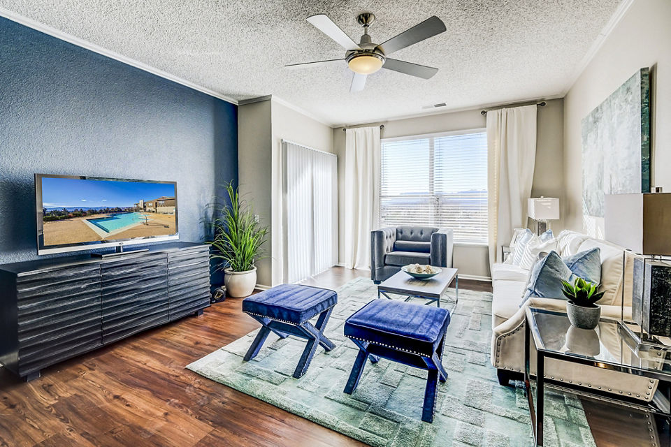 Spacious living room with modern decor at Commons at Briargate Apartments