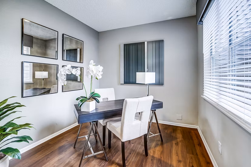 Home office with ergonomic desk and modern decor at Commons at Briargate Apartments, offering a productive workspace in luxury apartment setting