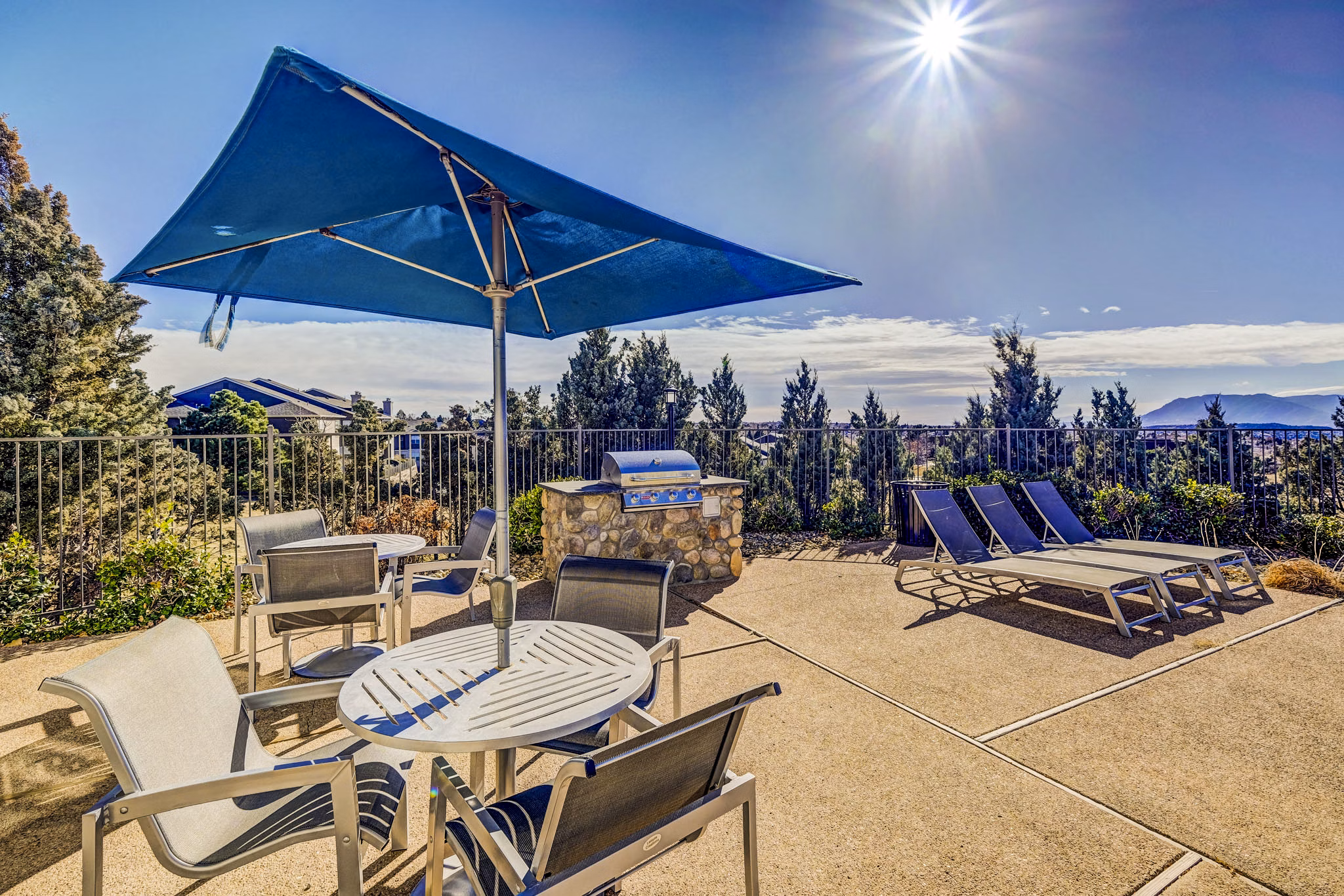 Outdoor grill area with modern design at Commons at Briargate Apartments