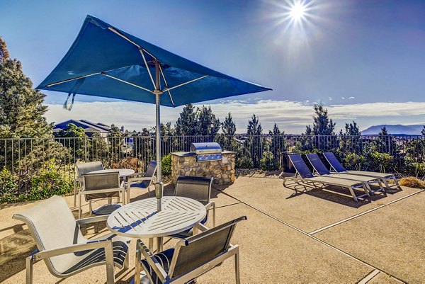 Outdoor grill area with modern design at Commons at Briargate Apartments
