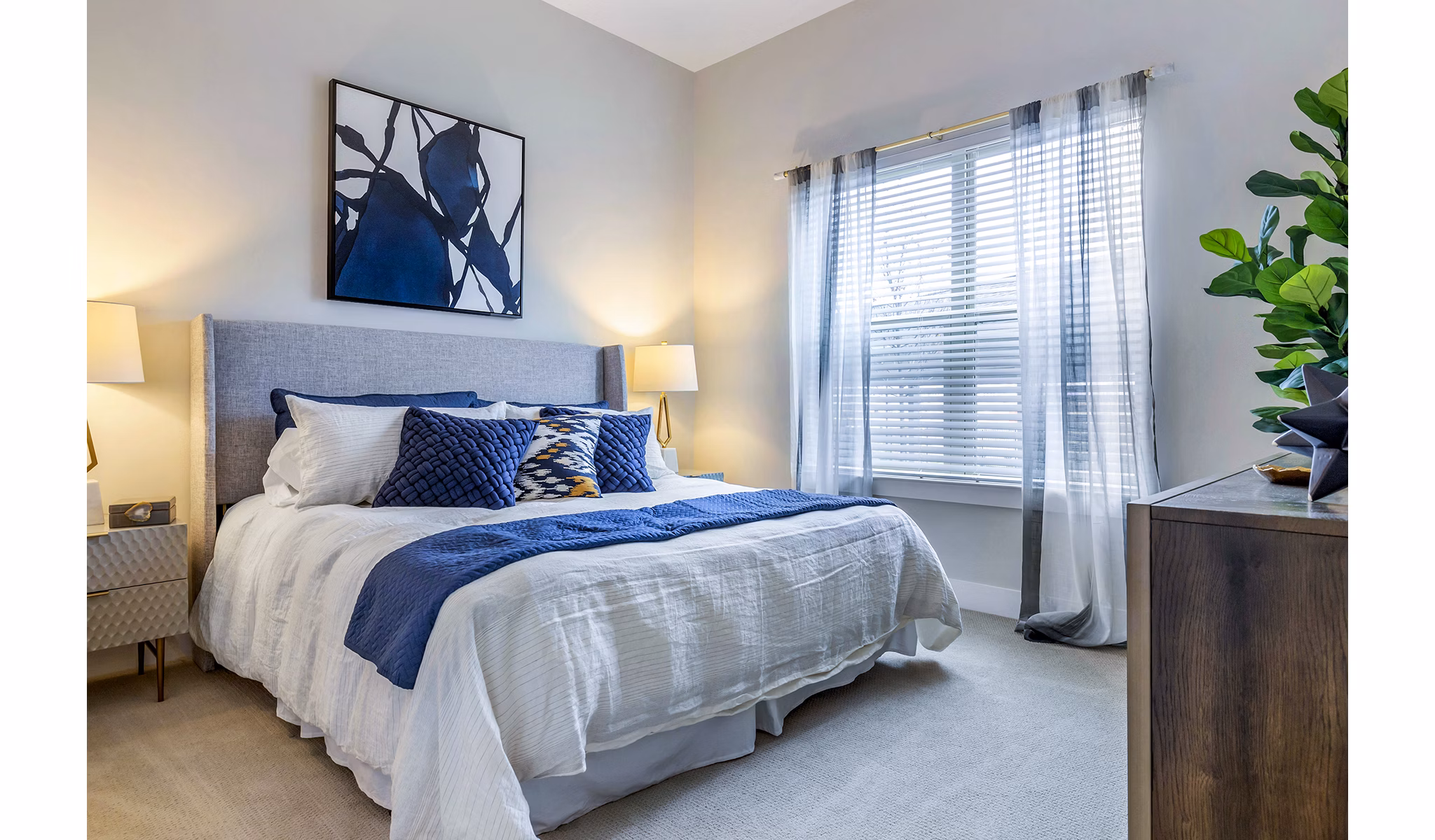 Luxurious bedroom with elegant decor at Overture Providence Apartments, perfect for upscale living in a serene environment