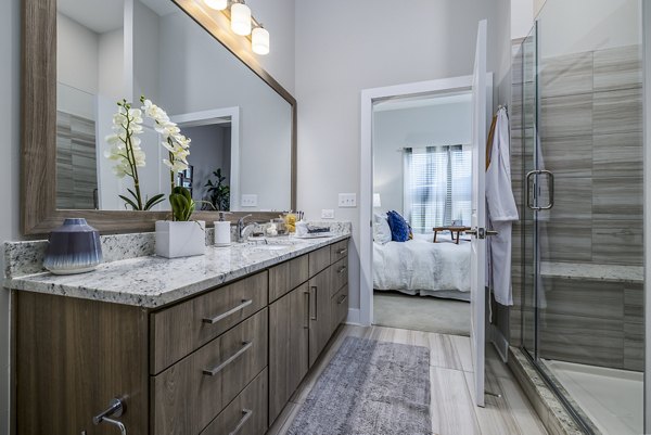 Overture Providence Apartments: Elegant bathroom with marble countertops and modern fixtures for a luxury living experience