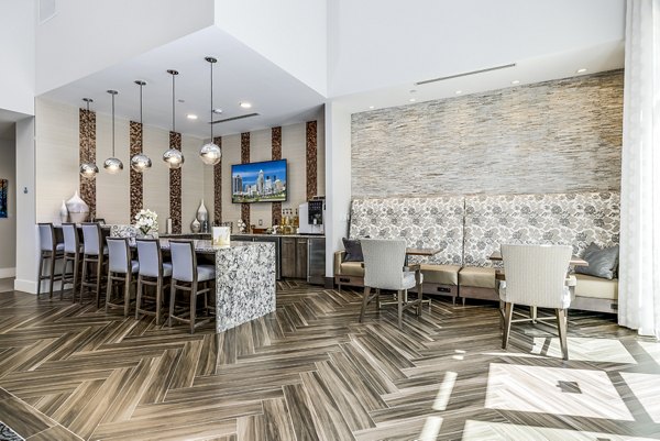 Overture Providence: Modern clubhouse lobby with contemporary seating and elegant lighting fixtures in a luxury apartment setting