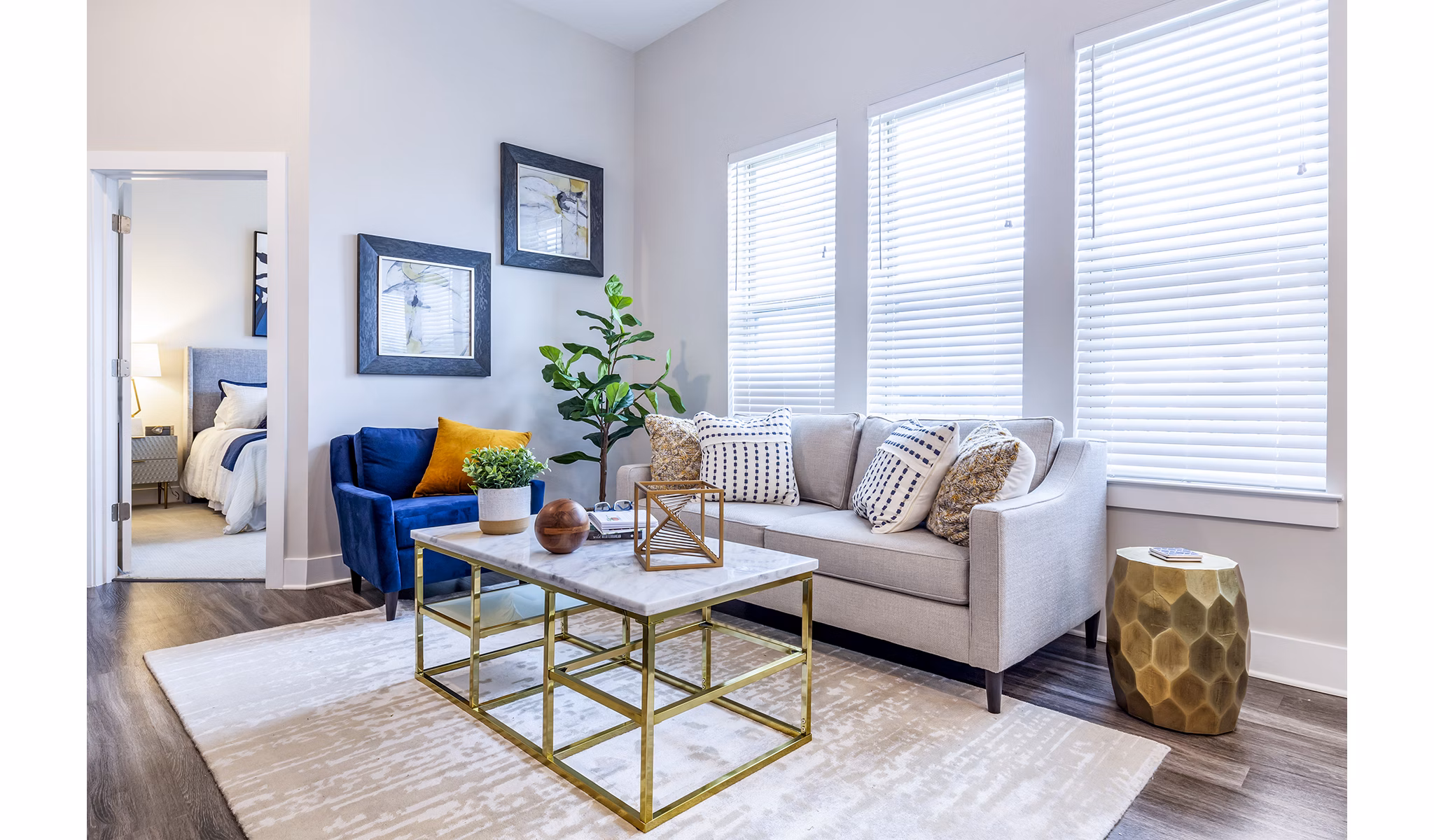 Modern living room with plush seating and ample natural light at Overture Providence Apartments, a Greystar luxury apartment community