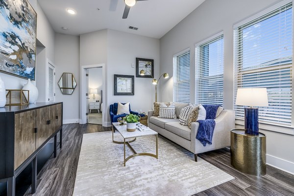 Spacious modern living room with sleek furnishings at Overture Providence Apartments in a luxurious setting