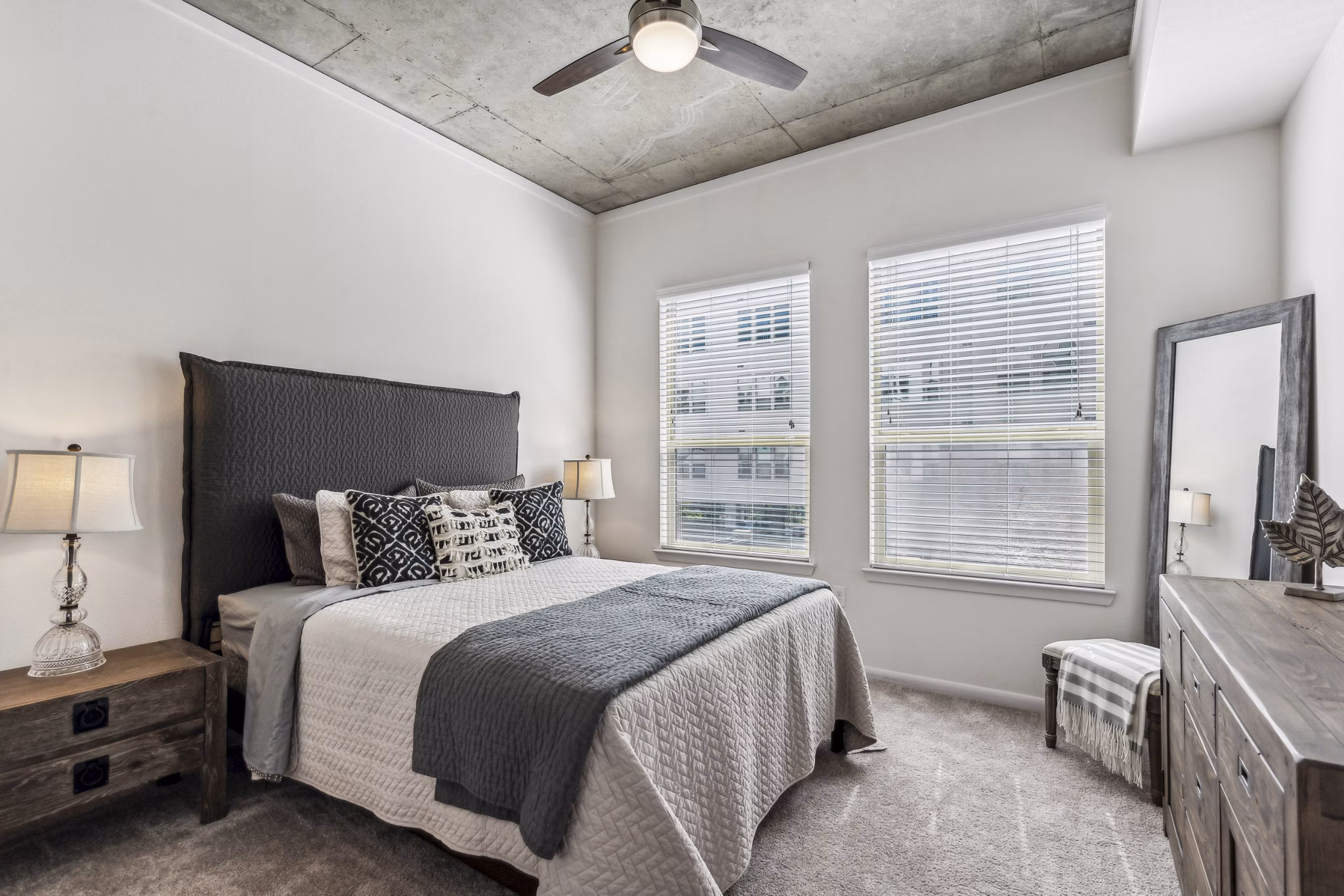 Elegant bedroom with modern decor in Gallery at Turtle Creek Apartments, showcasing luxury living