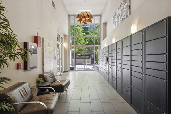 Modern mail room with package lockers at Gallery at Turtle Creek Apartments