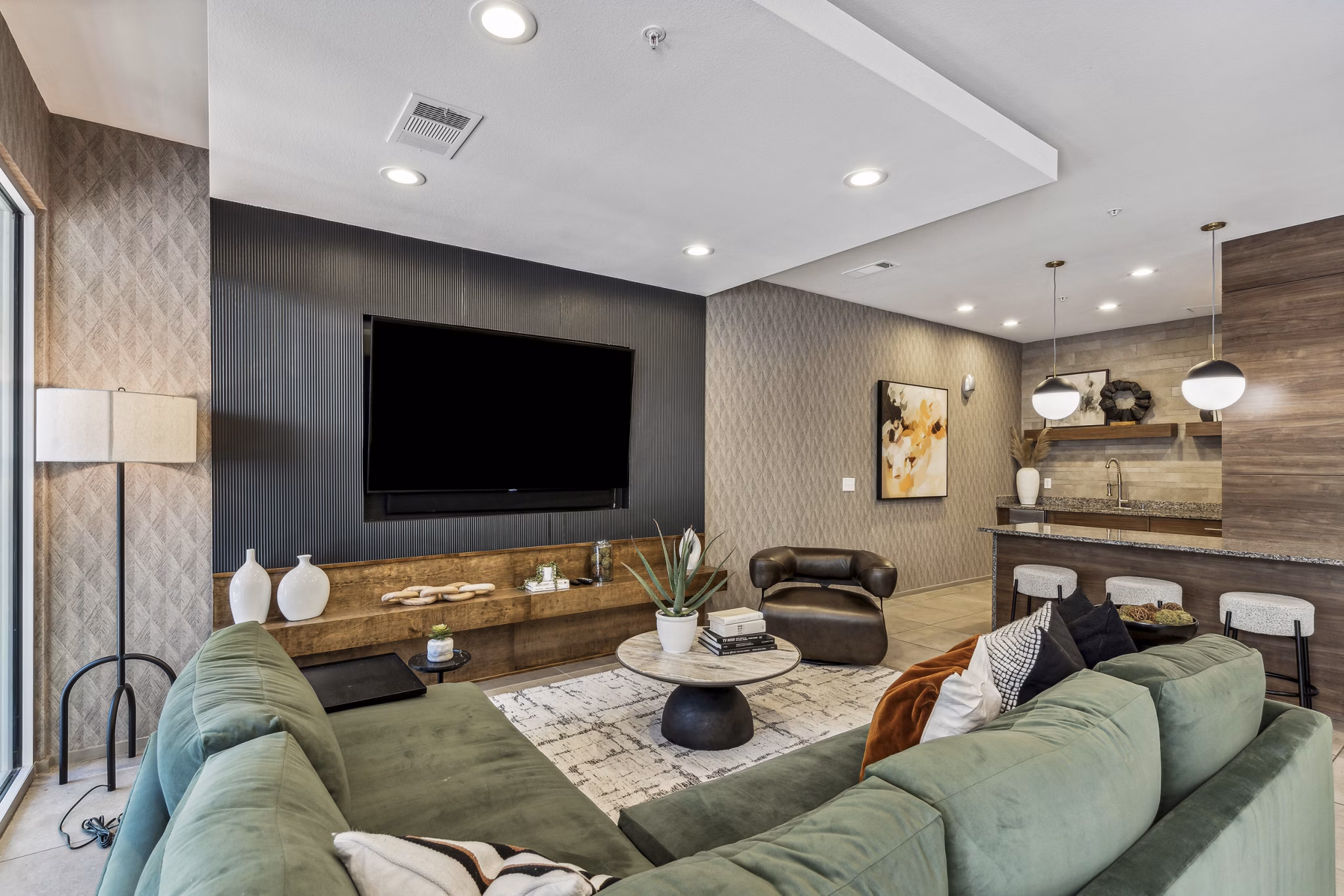Clubhouse featuring modern design and cozy seating at Gallery at Turtle Creek Apartments, a luxury Greystar-managed property