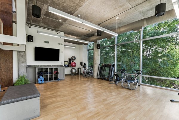 Modern fitness center with advanced equipment at Gallery at Turtle Creek Apartments offering luxury living amenities