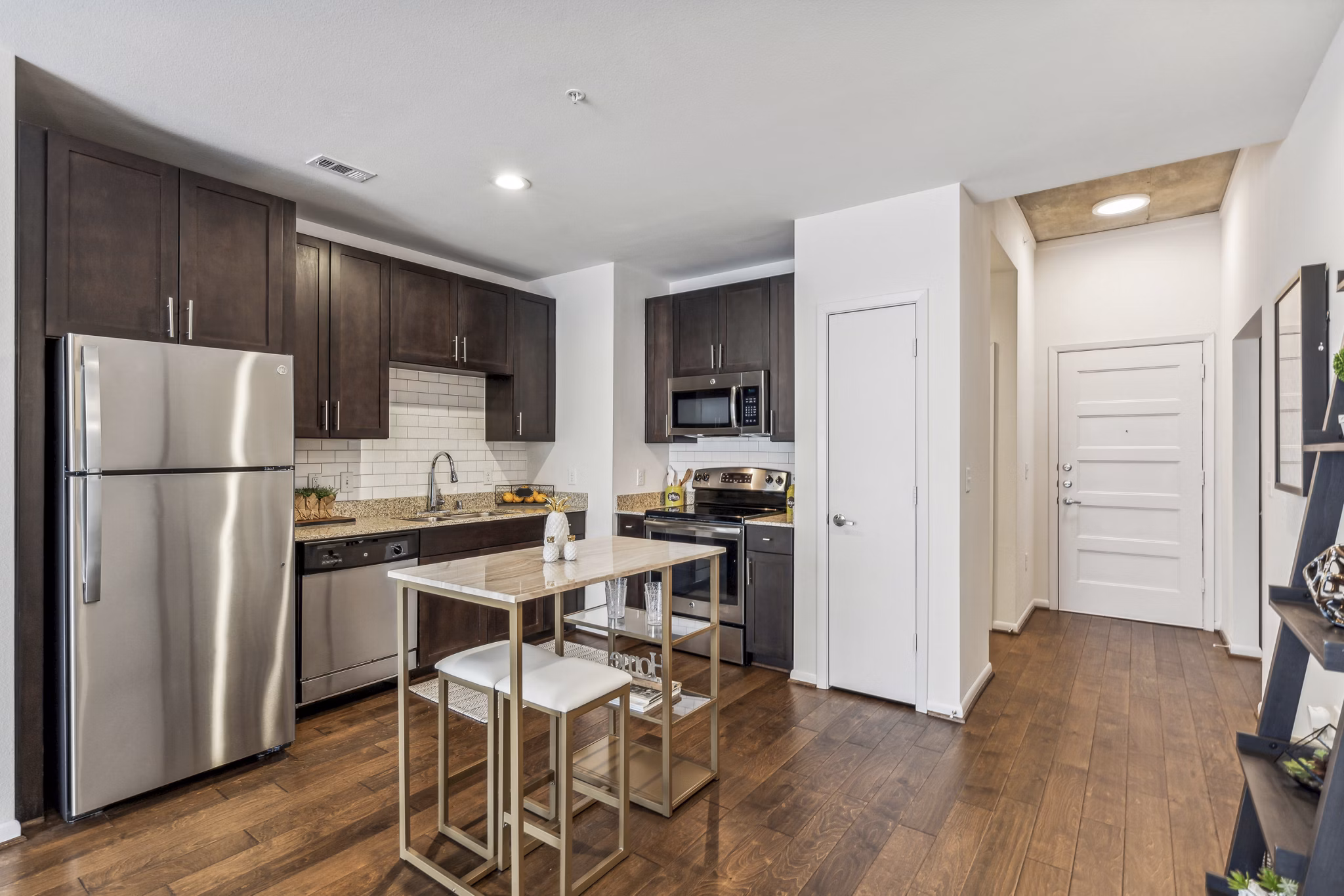 Modern kitchen with sleek countertops and stainless appliances in Gallery at Turtle Creek Apartments