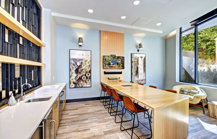 Clubhouse with cozy seating and modern lighting at Aura West Seattle Apartments