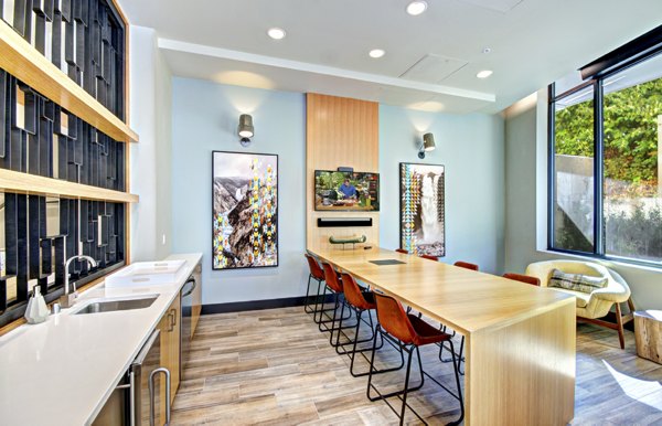 Clubhouse with cozy seating and modern lighting at Aura West Seattle Apartments