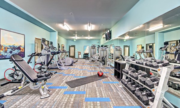 State-of-the-art fitness center at Aura West Seattle Apartments with modern equipment and ample space for workouts