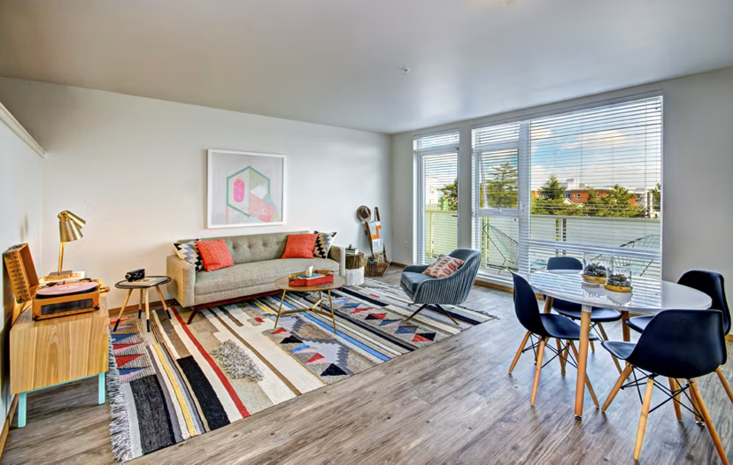 Spacious living room with modern decor at Aura West Seattle Apartments