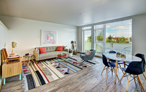Spacious living room with modern decor at Aura West Seattle Apartments