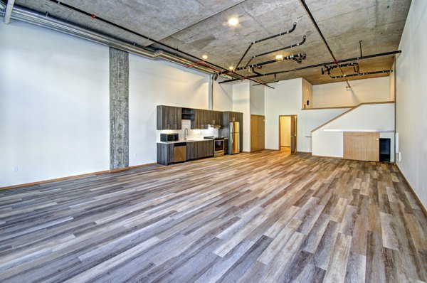 Spacious living room with modern decor at Aura West Seattle Apartments