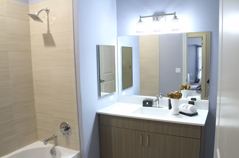 Modern bathroom with sleek fixtures at The Harper at Harmon Meadow Apartments