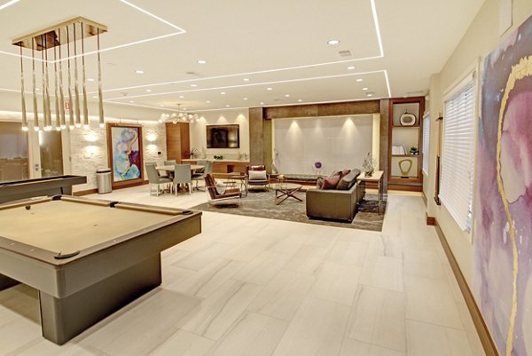 Clubhouse with elegant seating and modern decor at The Harper at Harmon Meadow Apartments