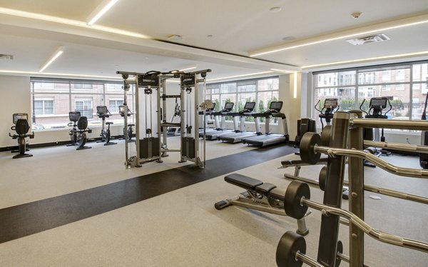 State-of-the-art fitness center with modern equipment at The Harper at Harmon Meadow Apartments