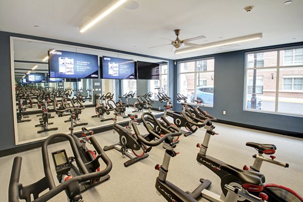 Spin studio with modern equipment at The Harper at Harmon Meadow Apartments