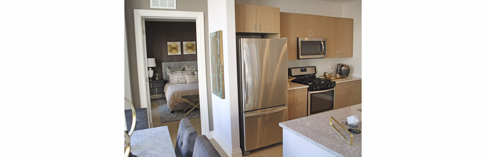 The Harper at Harmon Meadow: Modern kitchen with sleek cabinetry and stainless steel appliances