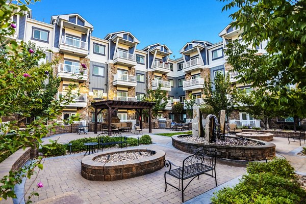 Tranquil courtyard with lush greenery at Cottages on 7th, a 55+ luxury apartment community