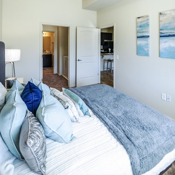 Cozy bedroom with modern furnishings at Cottages on 7th, a 55+ community