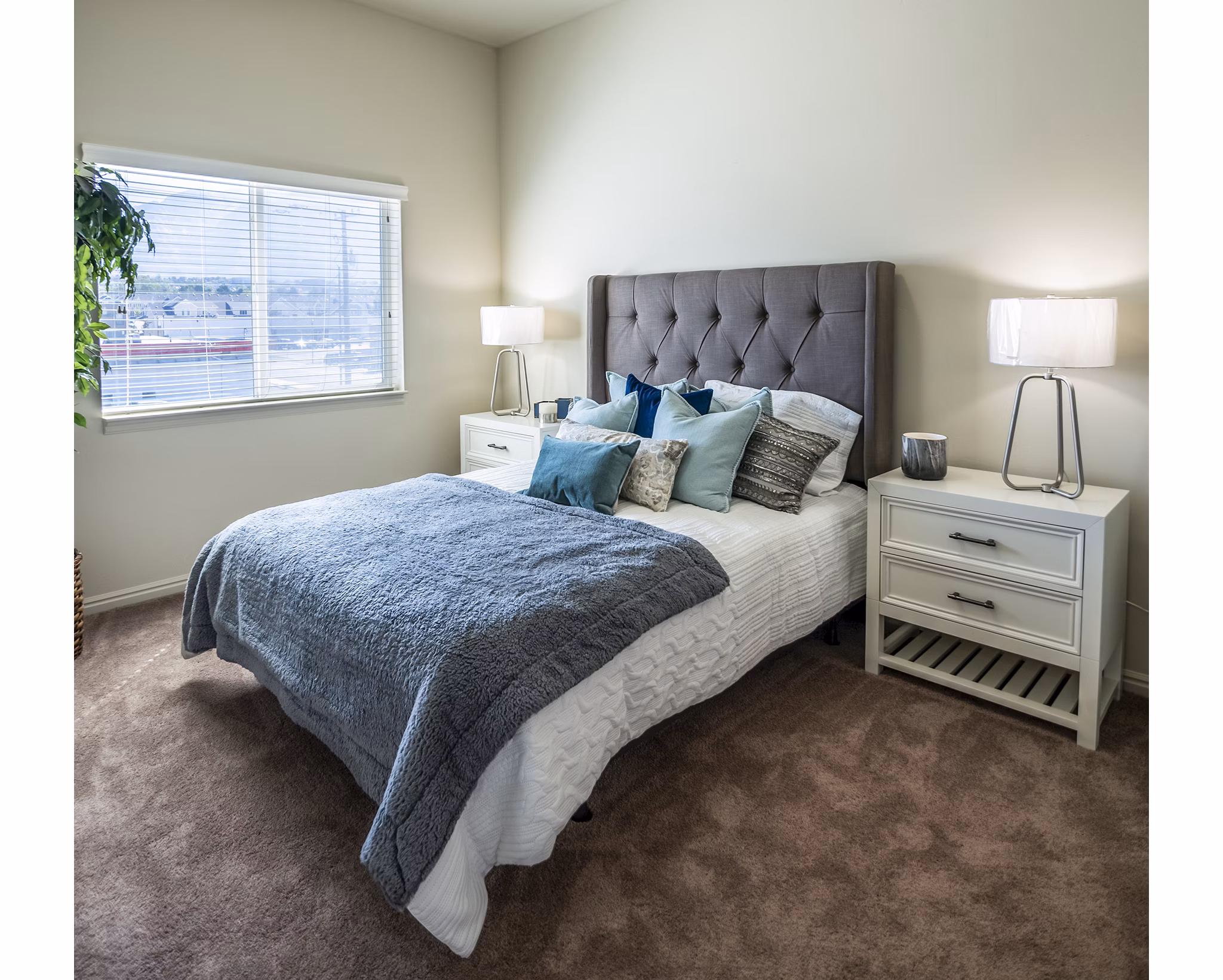 Modern bedroom with cozy decor at Cottages on 7th, a 55+ community apartments