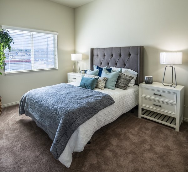 Modern bedroom with cozy decor at Cottages on 7th, a 55+ community apartments
