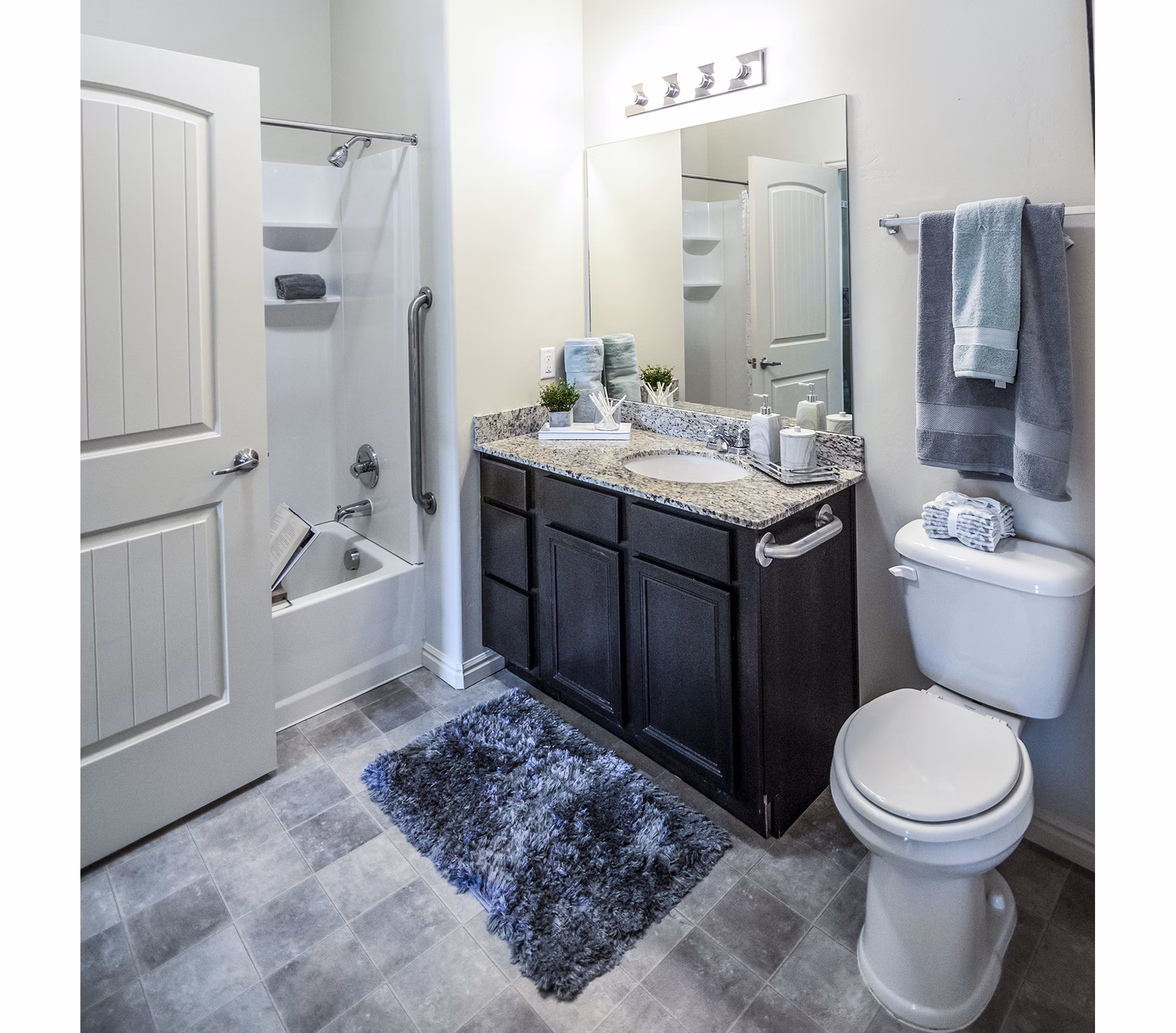 Modern bathroom with sleek finishes at Cottages on 7th, a 55+ Community Apartments